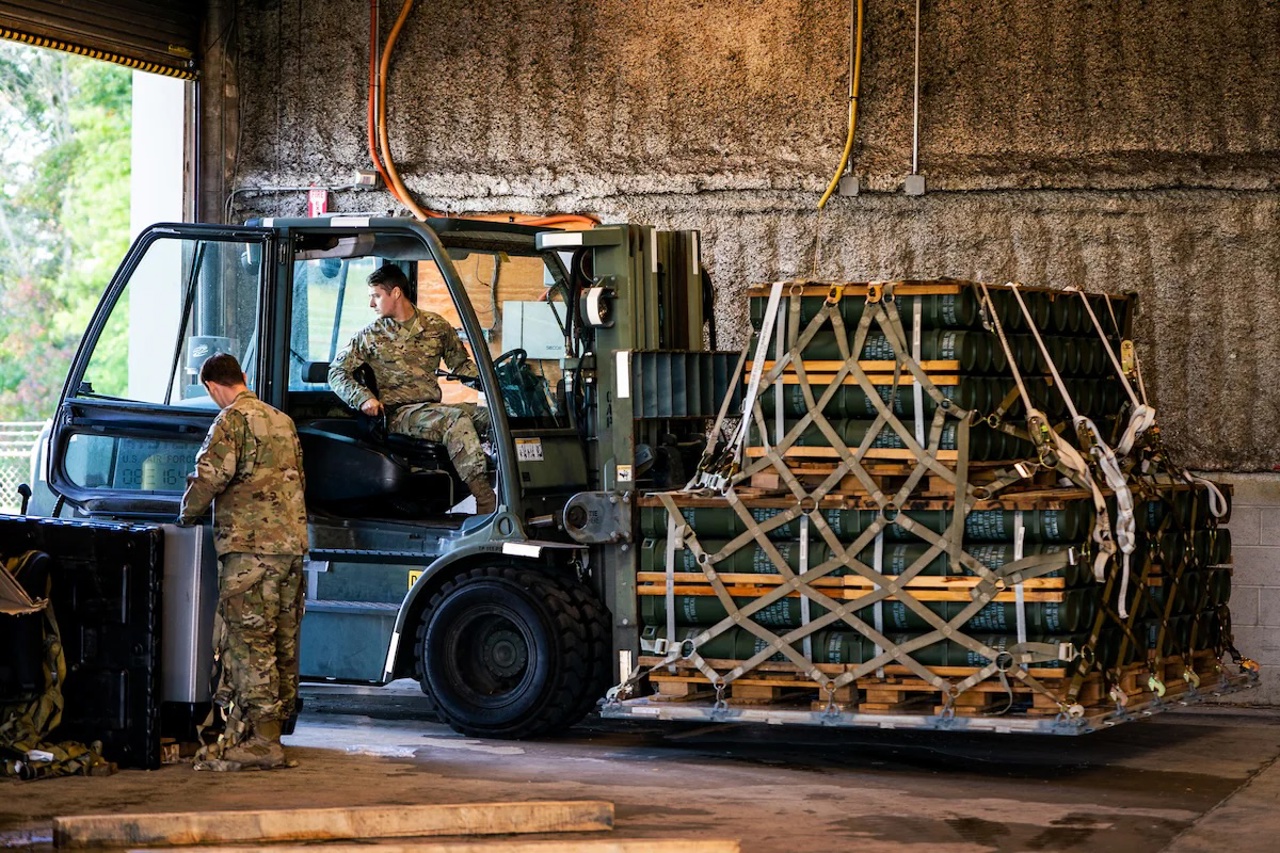 Washington Post / U.S. Air Force personnel in Dover, Del., move pallets of explosive charges for 155 mm artillery ammunition bound for Ukraine in October 2022