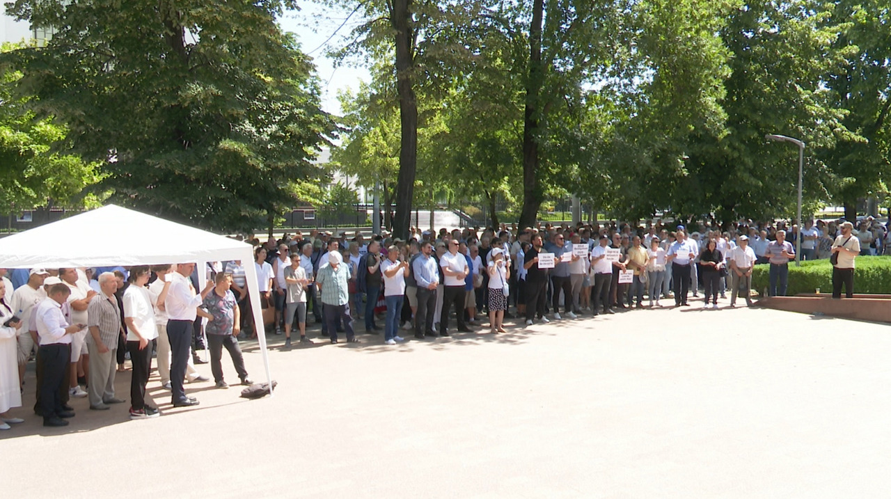 Protesters surround Moldova parliament as government halts tax reform
